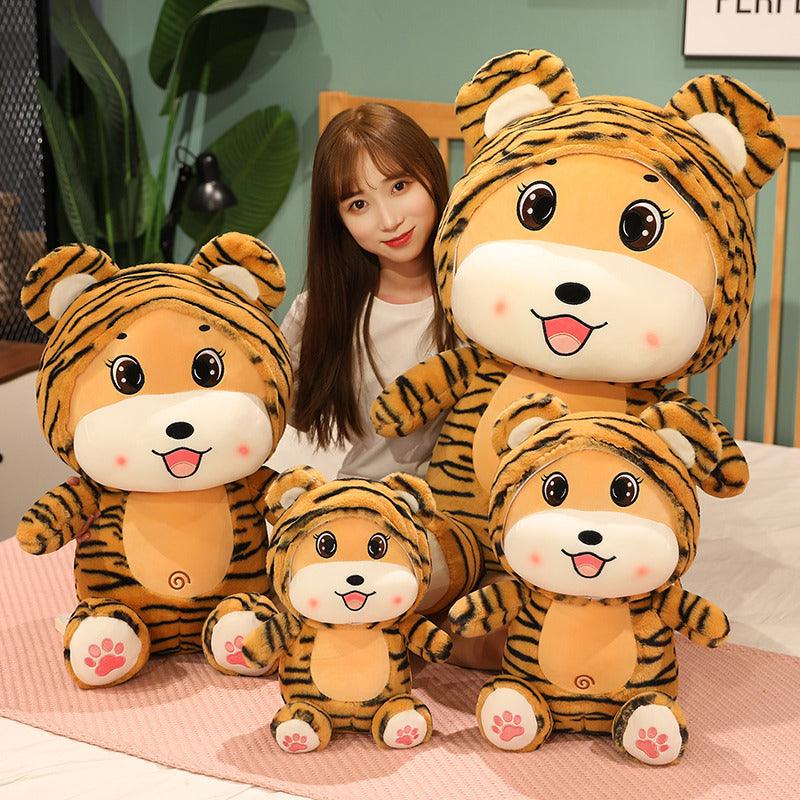 Peluches tigre assis et souriant