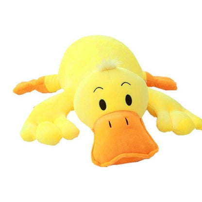 Oreiller en peluche canard jaune couché