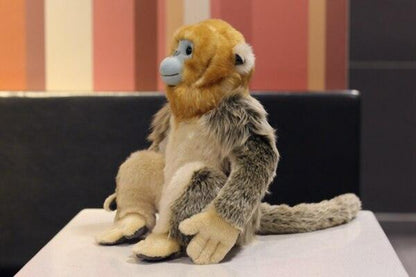 Realistic golden monkey plush toy sitting