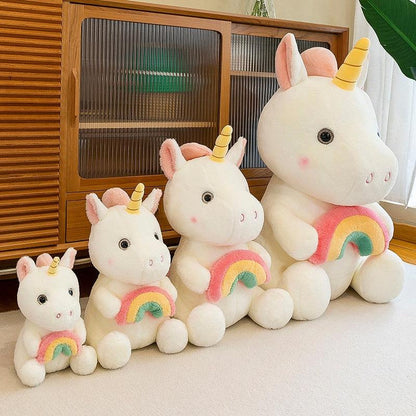 Adorable plush unicorn holding a rainbow