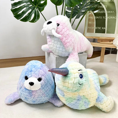 Colorful seal, sea lion and narwhal soft toys