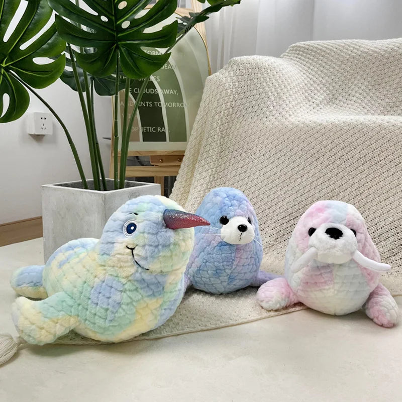 Colorful seal, sea lion and narwhal soft toys