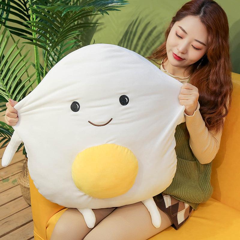 Plush pillow with egg and egg yolk