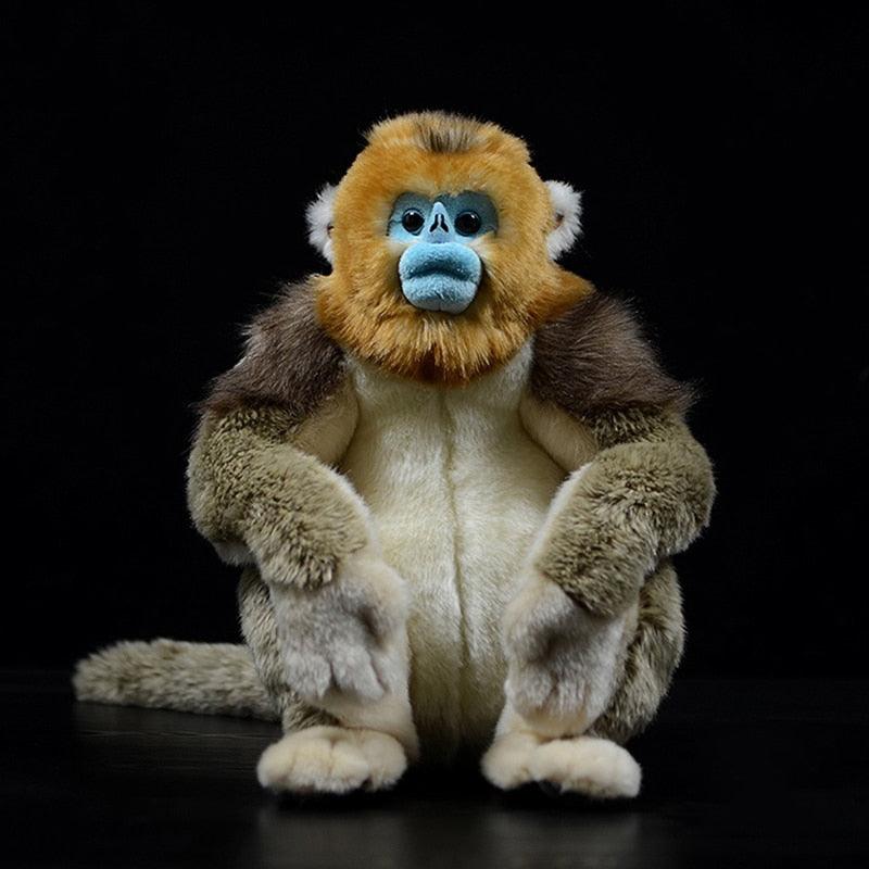 Realistic golden monkey plush toy sitting