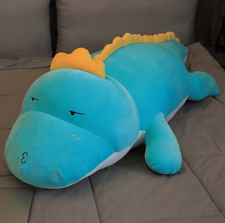 Poupée dinosaure en peluche