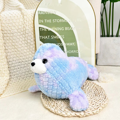 Colorful seal, sea lion and narwhal soft toys