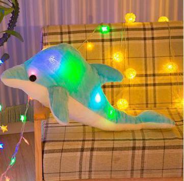 Luminous plush dolphin pillow