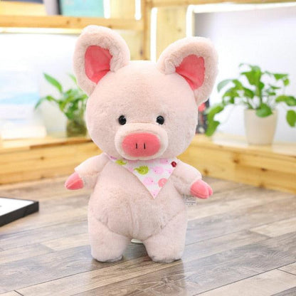 Giant pink pig plush toy with decorative scarf