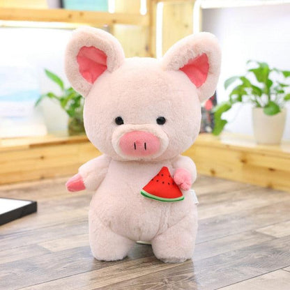 Giant pink pig plush toy with decorative scarf