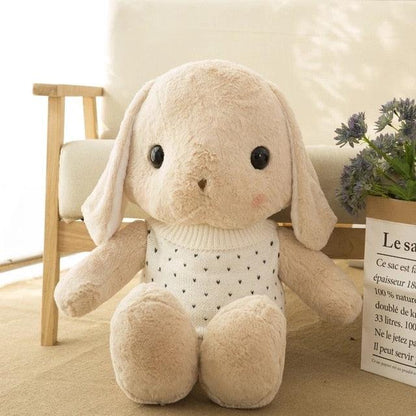 Long-eared rabbit plush wearing a sweater