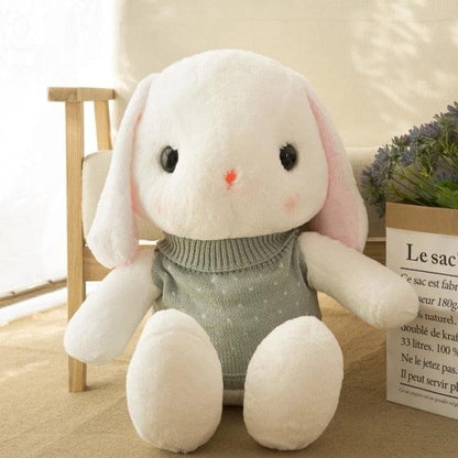 Long-eared rabbit plush wearing a sweater