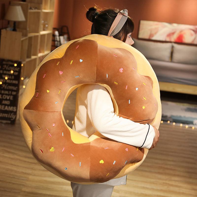 Giant plush donut cushions