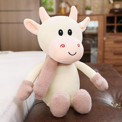 Animal en peluche vache avec jupe