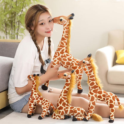 Small kneeling giraffe soft toy