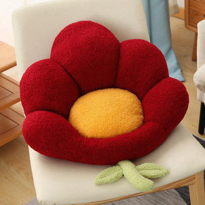 Seating pillows in the shape of a multi-colored flowered bench