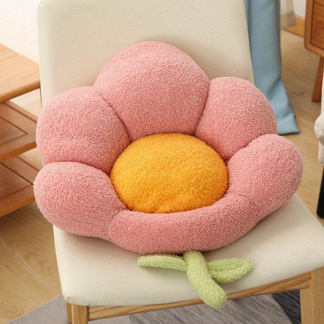 Seating pillows in the shape of a multi-colored flowered bench