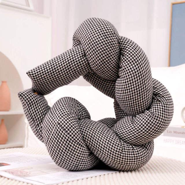 Multifunctional Pillow with Long Twisted Braids